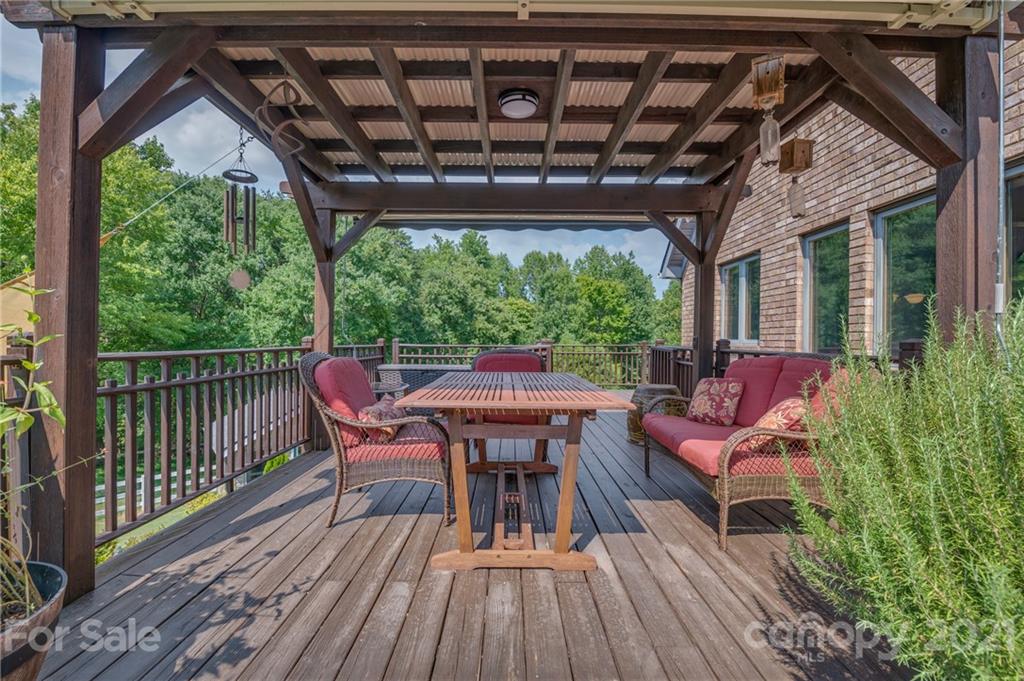 2101 Peniel Road Columbus, NC 28722 - Photo 13 of 48 a view of a chairs on the roof deck