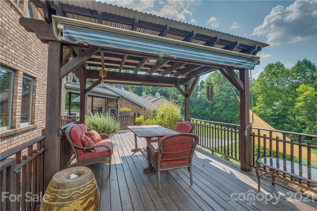 2101 Peniel Road Columbus, NC 28722 - Photo 15 of 48 a patio with patio lots of furniture and wooden floor