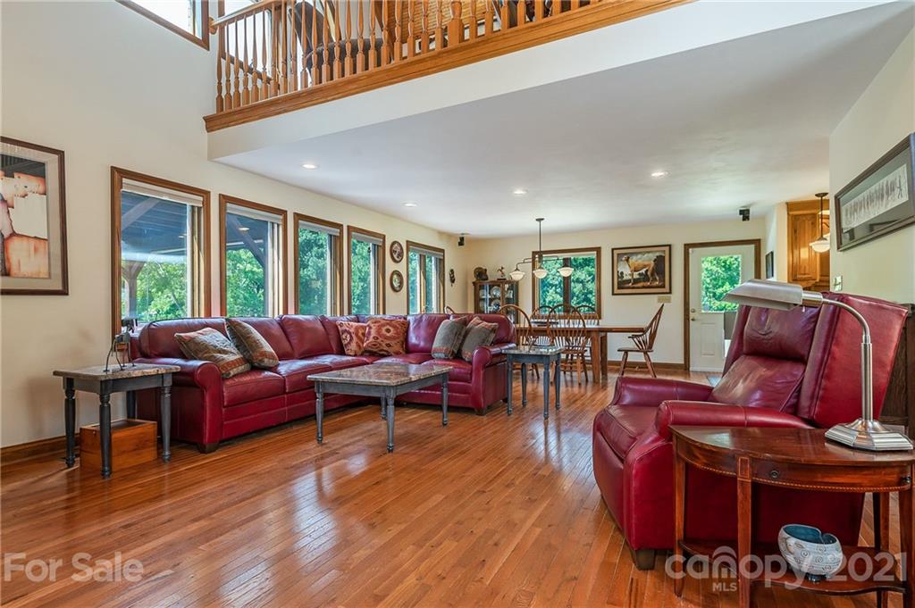 2101 Peniel Road Columbus, NC 28722 - Photo 22 of 48 a living room with furniture a fireplace and a large window