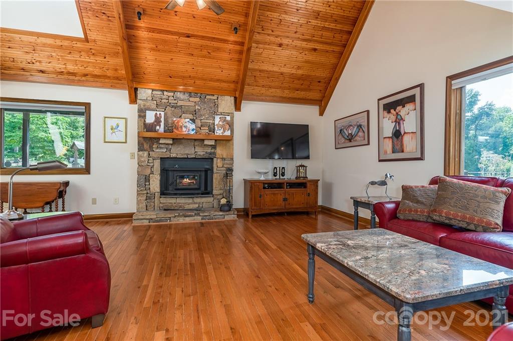 2101 Peniel Road Columbus, NC 28722 - Photo 24 of 48 a living room with furniture and a fireplace