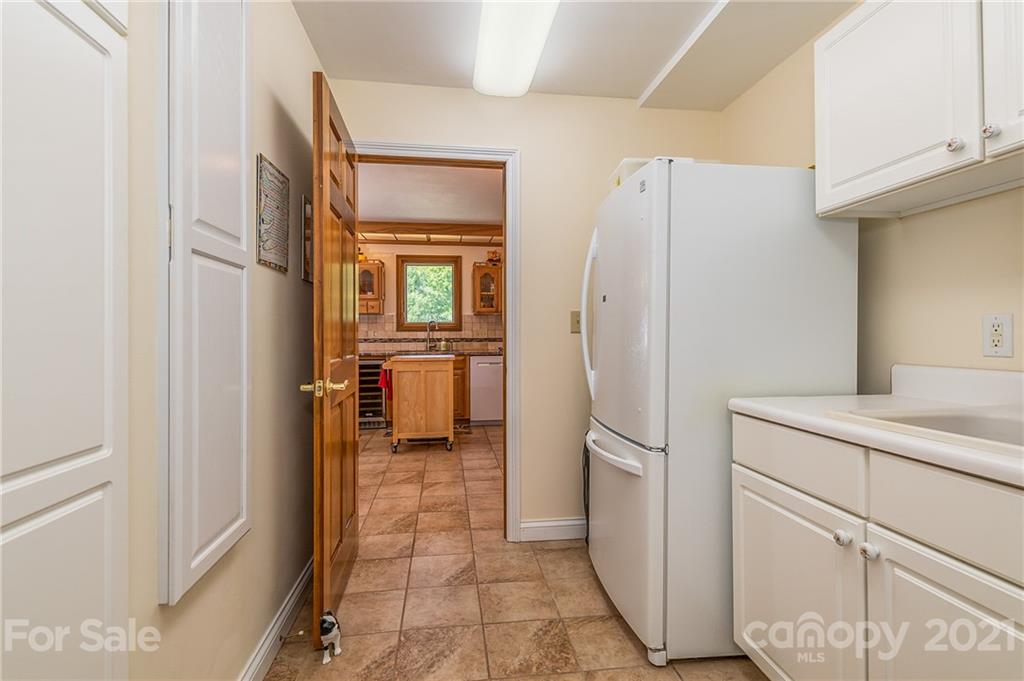 2101 Peniel Road Columbus, NC 28722 - Photo 31 of 48 a kitchen with a refrigerator and microwave