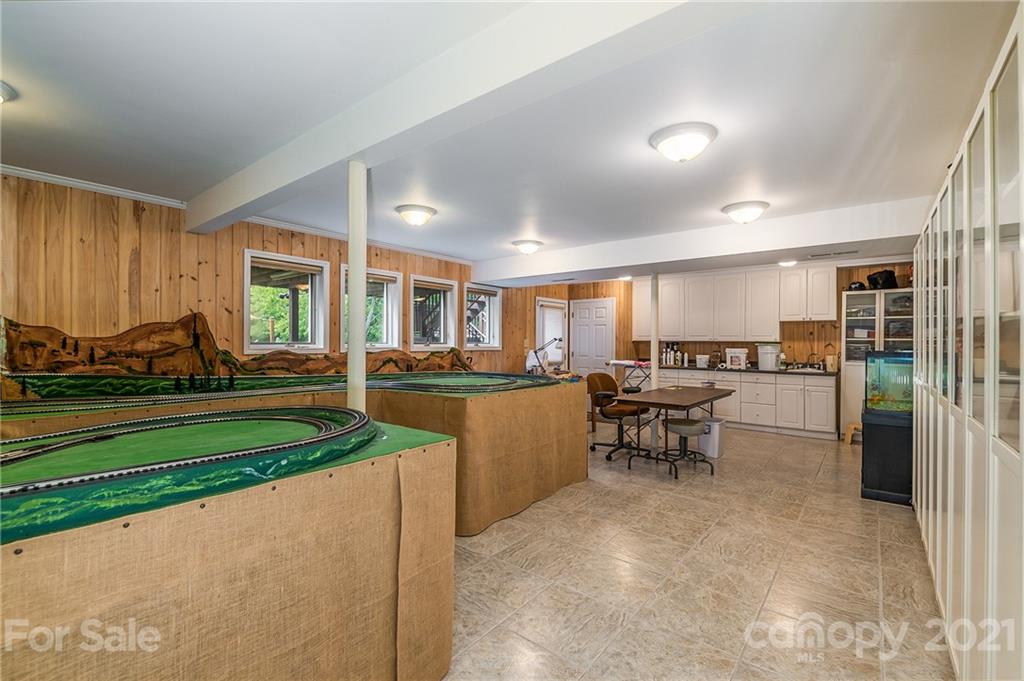 2101 Peniel Road Columbus, NC 28722 - Photo 37 of 48 a kitchen with a sink table and chairs
