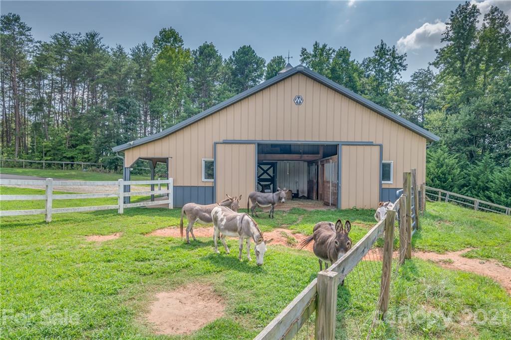 2101 Peniel Road Columbus, NC 28722 - Photo 5 of 48 a view of a house with a yard and deck