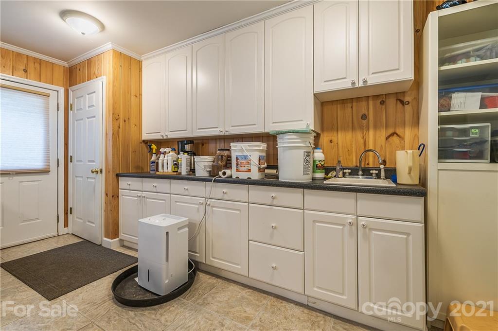 2101 Peniel Road Columbus, NC 28722 - Photo 41 of 48 a kitchen with white cabinets and sink