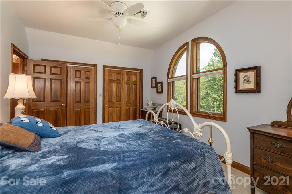 2101 Peniel Road Columbus, NC 28722 - Photo 48 of 48 a bedroom with a bed and a dresser