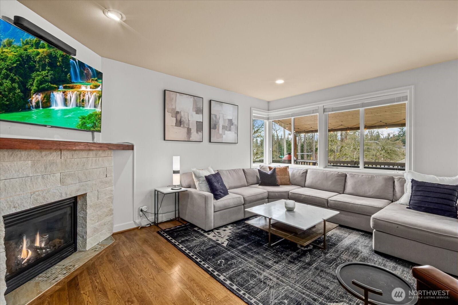 215 Ilwaco Place Southeast Renton, WA 98059 - Photo 12 of 40 a living room with furniture a window and a fireplace