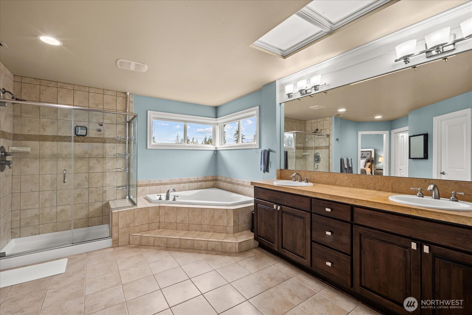 215 Ilwaco Place Southeast Renton, WA 98059 - Photo 17 of 40 a spacious bathroom with a large tub shower and sink