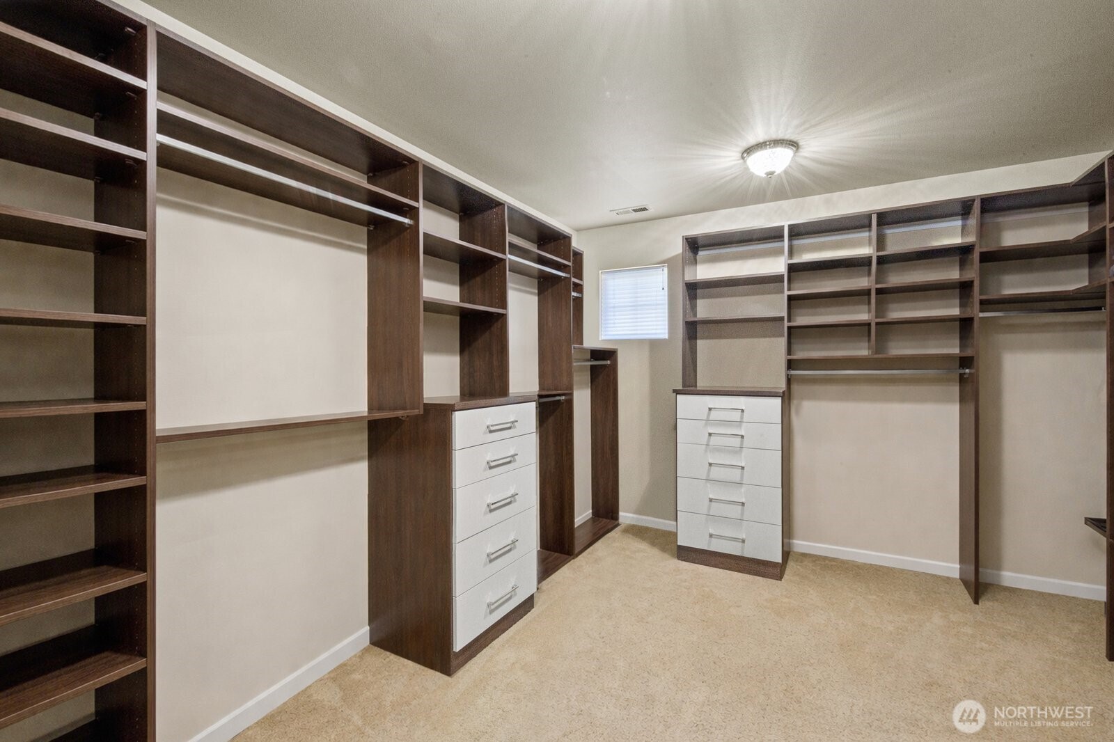 215 Ilwaco Place Southeast Renton, WA 98059 - Photo 20 of 40 a view of walk in closet with clothes and shoes