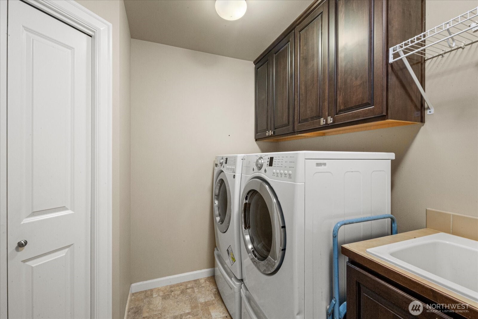 215 Ilwaco Place Southeast Renton, WA 98059 - Photo 22 of 40 a utility room with dryer and washer