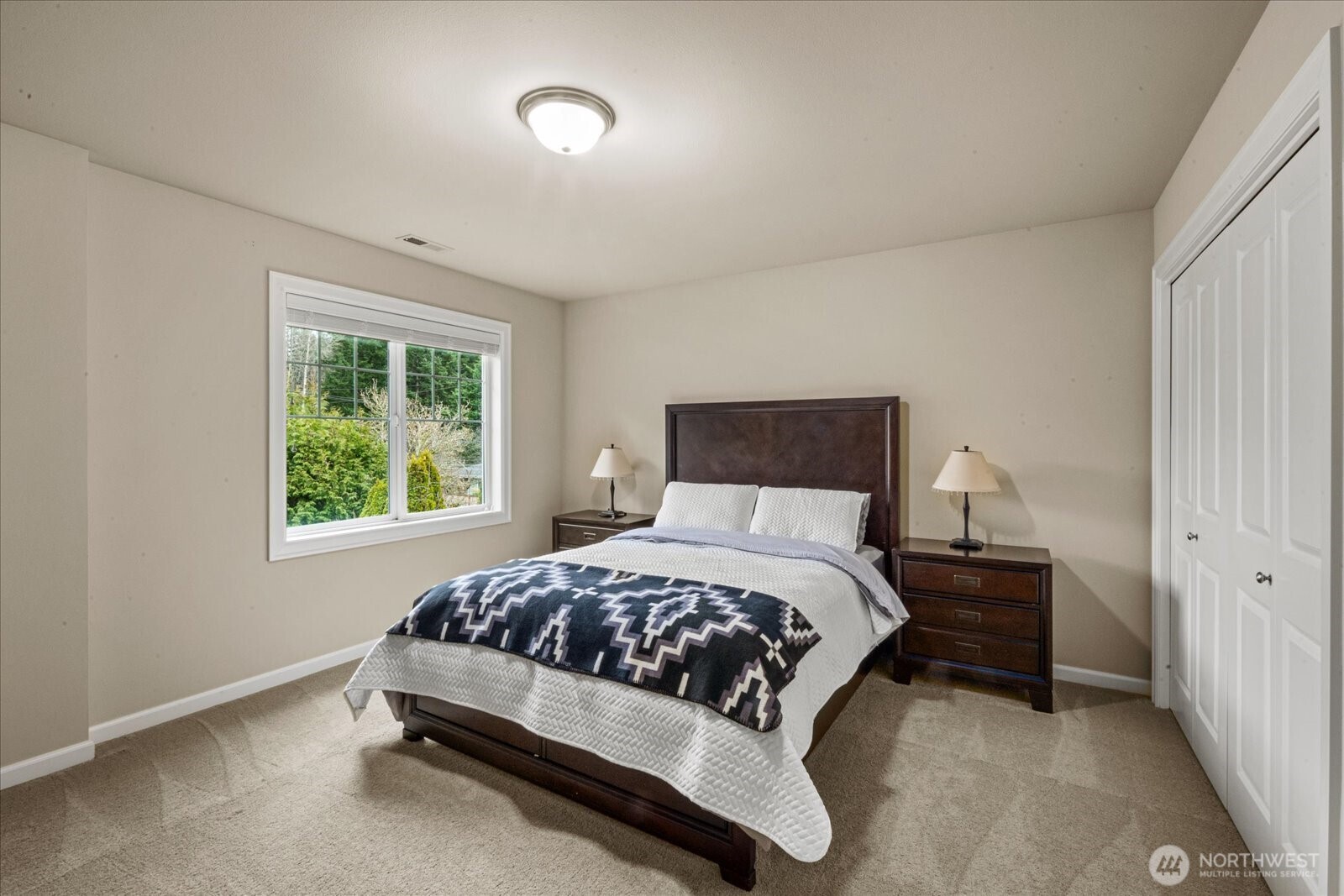 215 Ilwaco Place Southeast Renton, WA 98059 - Photo 23 of 40 a bedroom with a bed and a window
