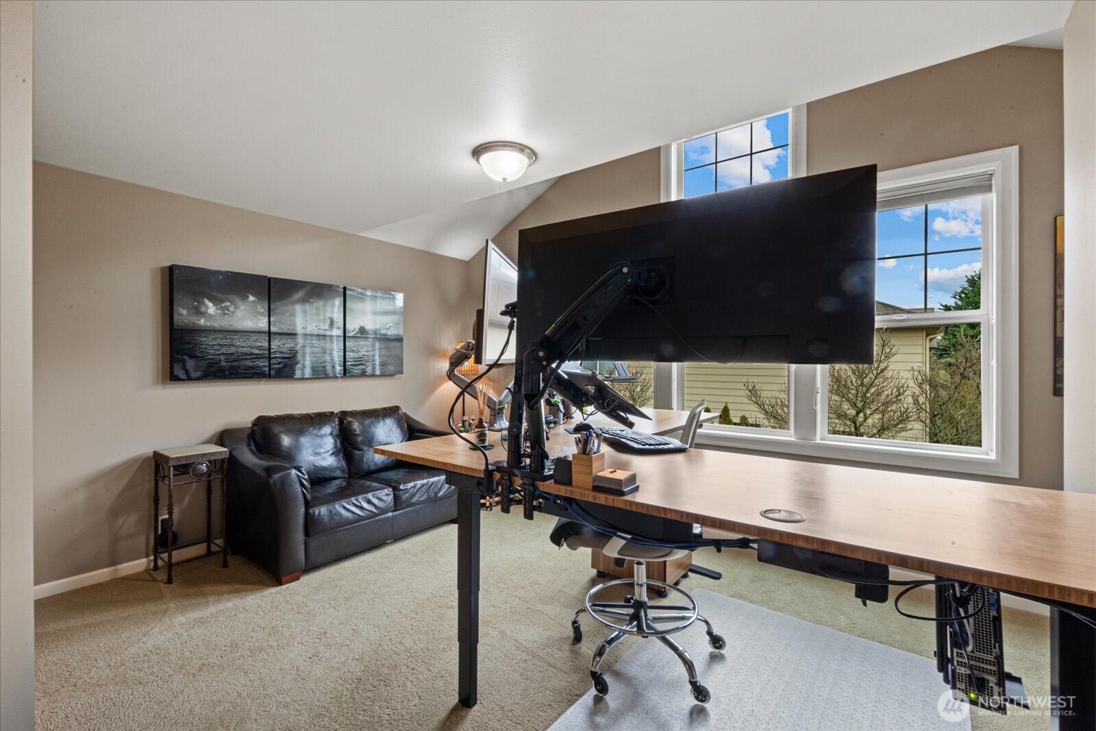 215 Ilwaco Place Southeast Renton, WA 98059 - Photo 27 of 40 a room with gym equipment and a flat screen tv