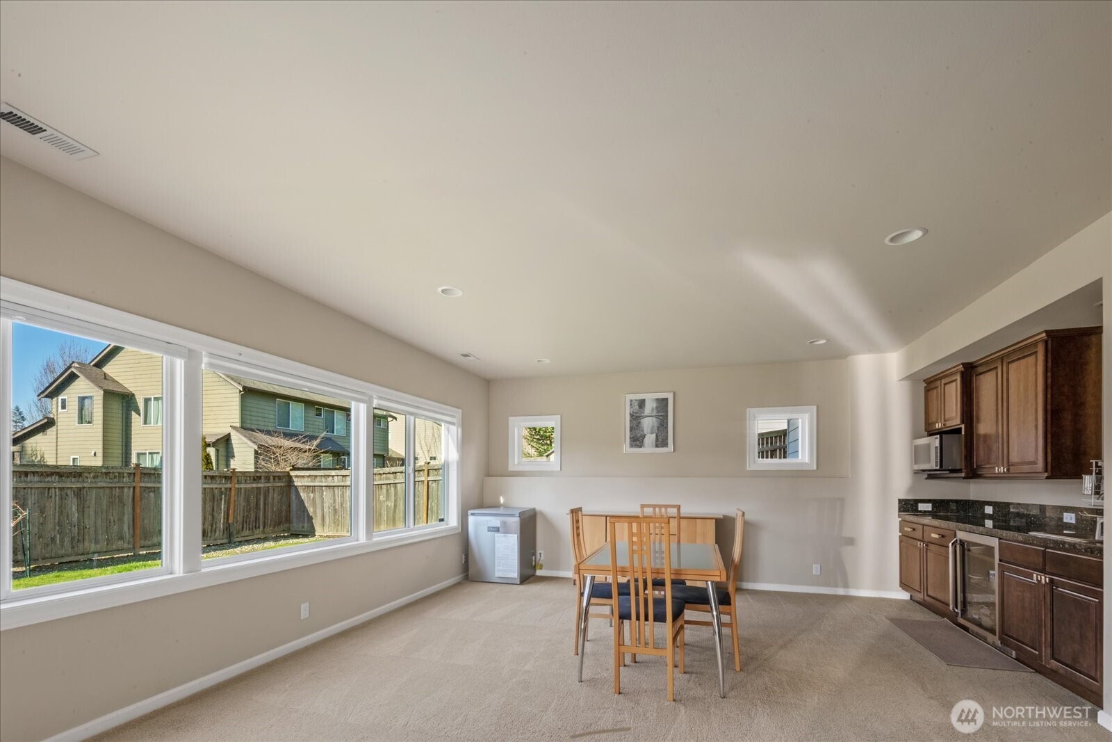 215 Ilwaco Place Southeast Renton, WA 98059 - Photo 35 of 40 a view of a livingroom with furniture wooden floor and windows