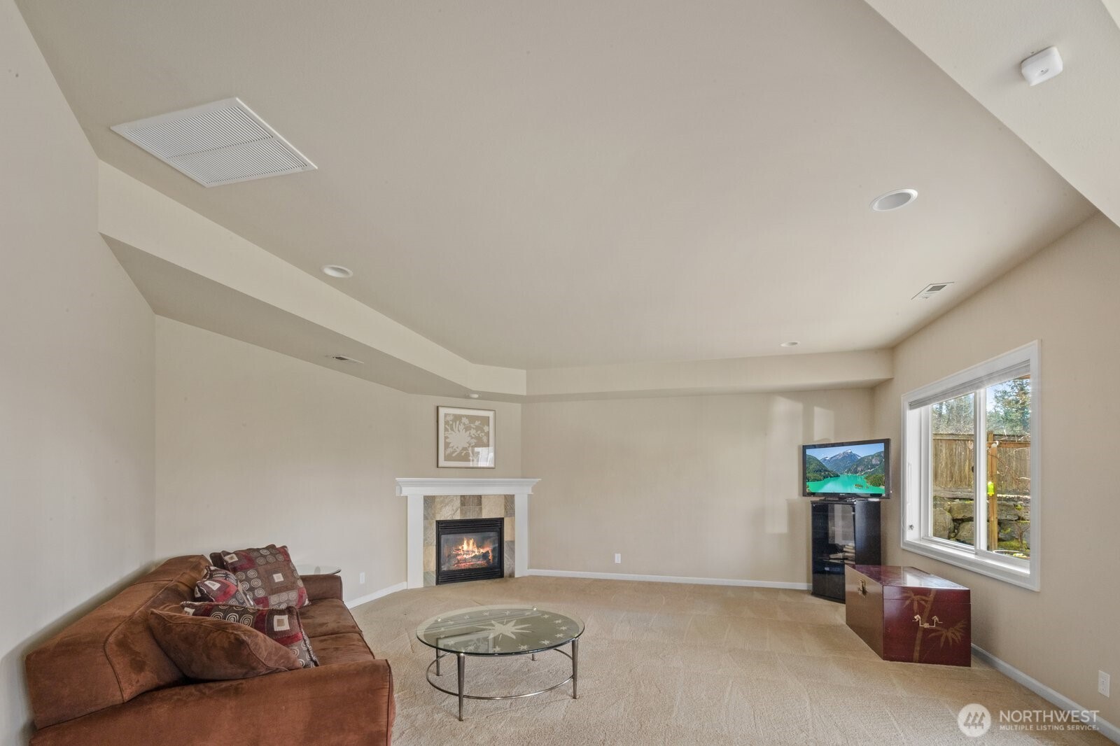 215 Ilwaco Place Southeast Renton, WA 98059 - Photo 37 of 40 a living room with furniture and a fireplace
