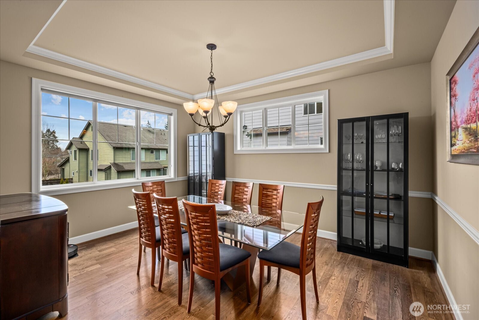 215 Ilwaco Place Southeast Renton, WA 98059 - Photo 8 of 40 a view of a dining room with furniture window and wooden floor