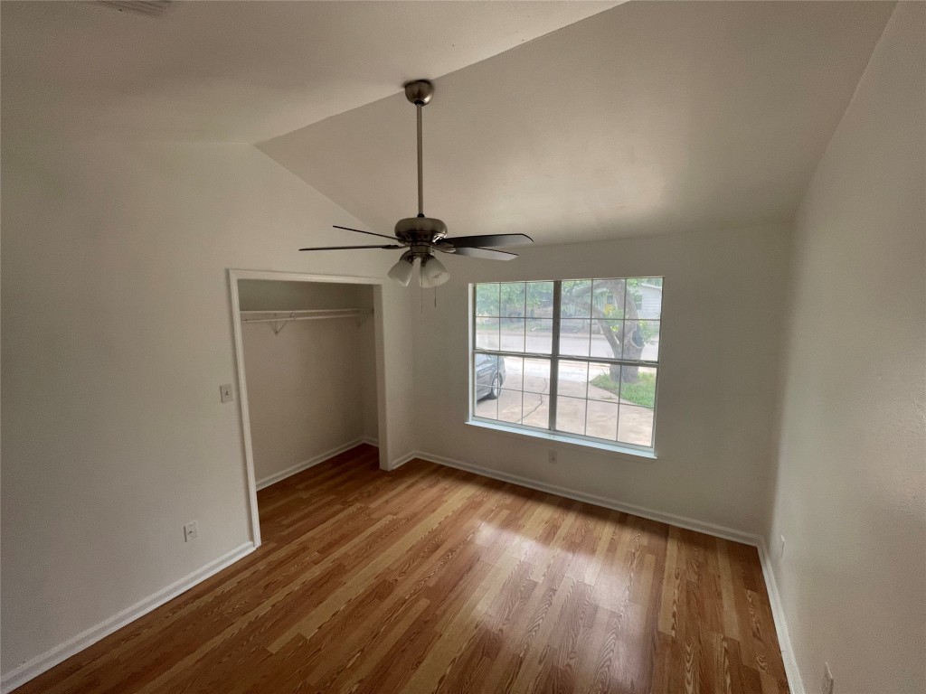 2808 Lyons Road, Unit A Austin, TX 78702 - Photo 2 of 13 a view of an empty room with a window and wooden floor