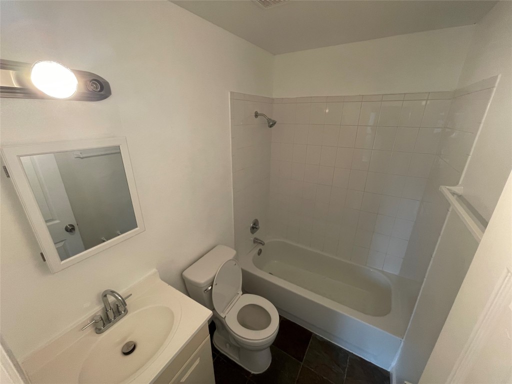 2808 Lyons Road, Unit A Austin, TX 78702 - Photo 4 of 13 a bathroom with a sink a toilet and shower
