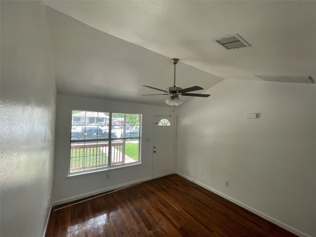 2808 Lyons Road, Unit A Austin, TX 78702 - Photo 8 of 13 an empty room with a window and wooden floor