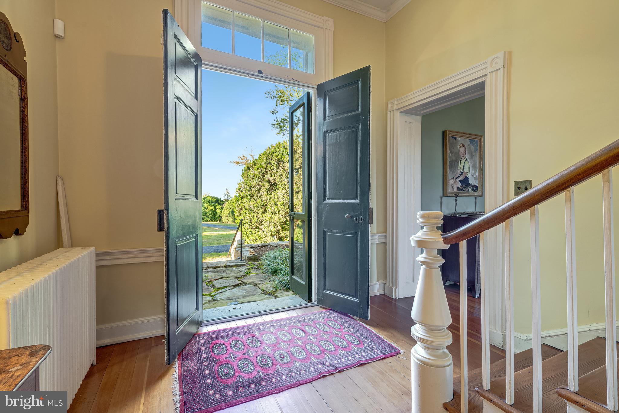 3707 Carrington Road Delaplane, VA 20144 - Photo 13 of 52 a view of entryway with wooden floor and a rug