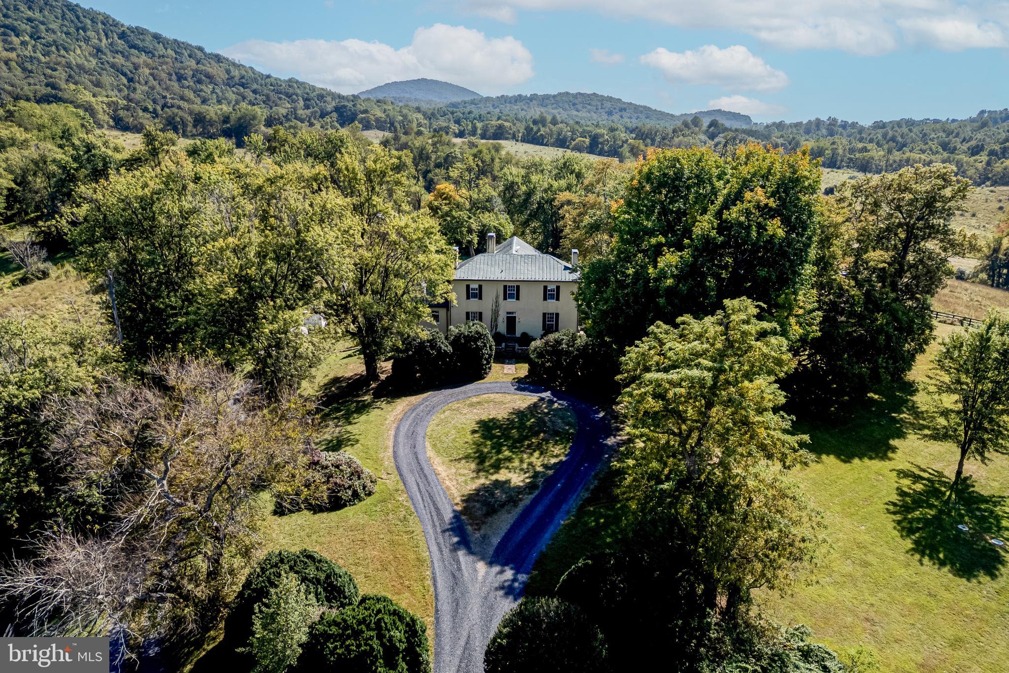 3707 Carrington Road Delaplane, VA 20144 - Photo 2 of 52 a view of a house with a yard and sitting area