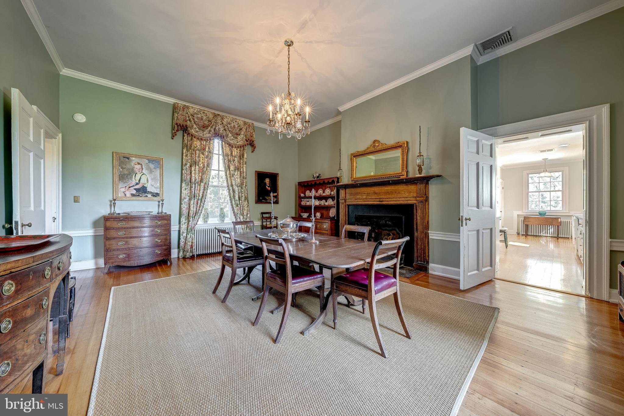 3707 Carrington Road Delaplane, VA 20144 - Photo 24 of 52 a view of a dining room with furniture and chandelier