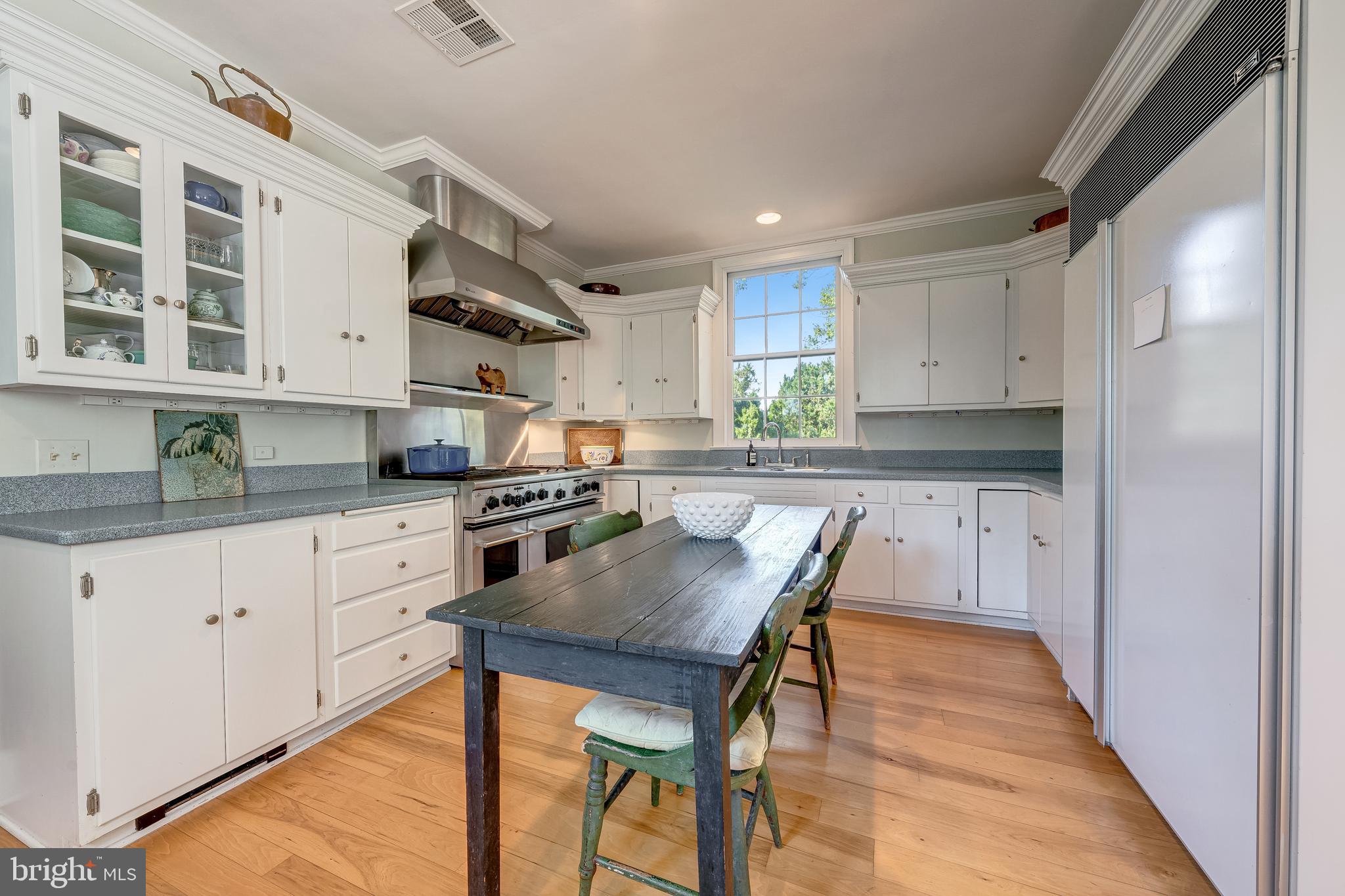 3707 Carrington Road Delaplane, VA 20144 - Photo 26 of 52 a kitchen with stainless steel appliances granite countertop a stove refrigerator sink and cabinets