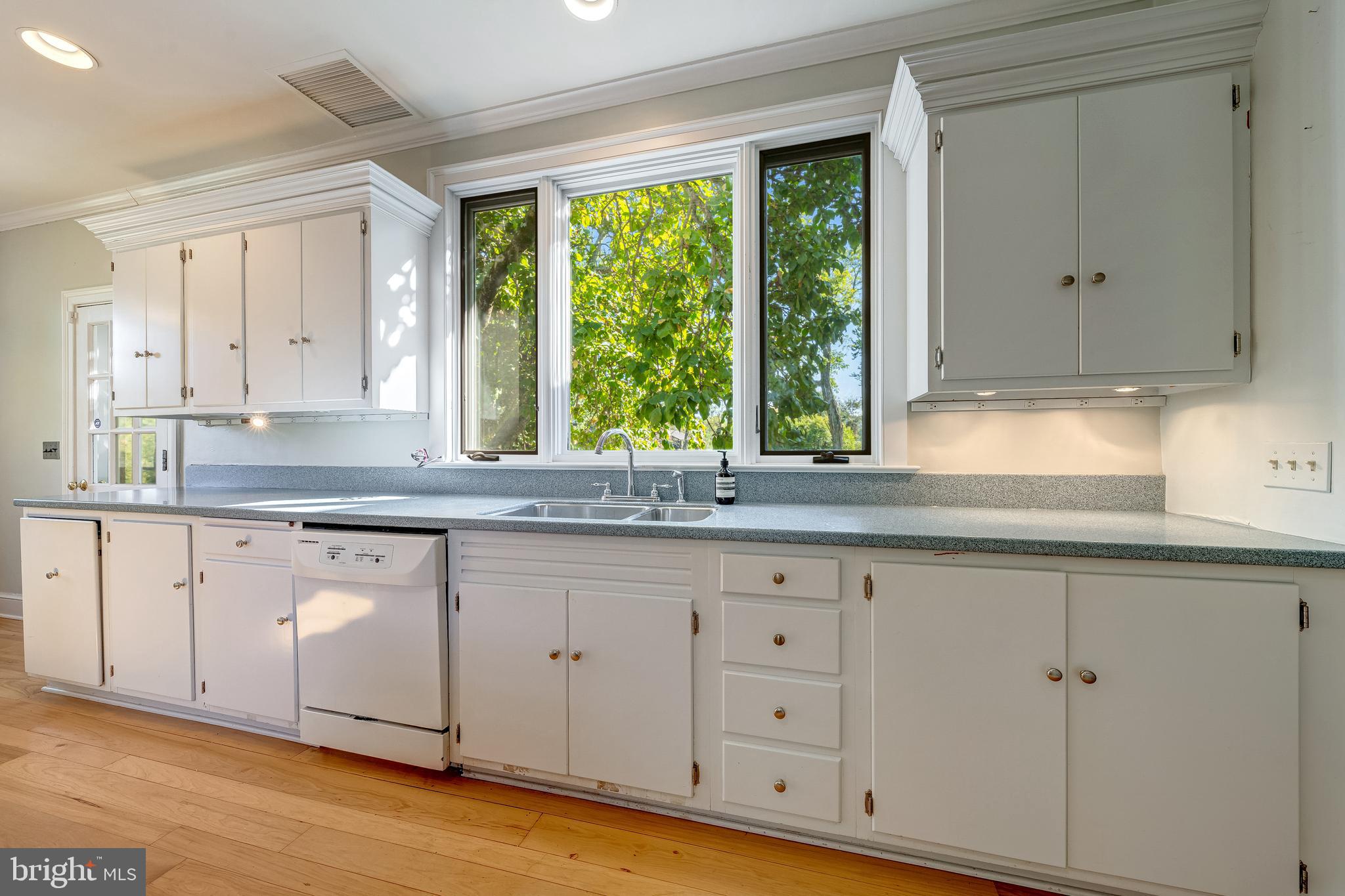 3707 Carrington Road Delaplane, VA 20144 - Photo 27 of 52 a kitchen with granite countertop white cabinets and a window