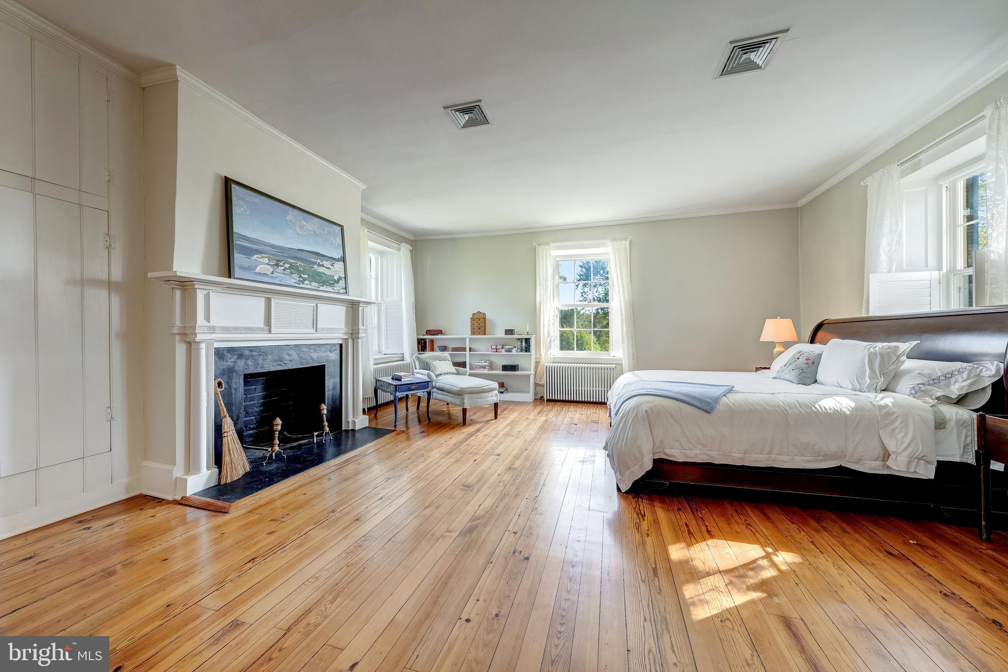 3707 Carrington Road Delaplane, VA 20144 - Photo 32 of 52 a bedroom with a bed and a fireplace