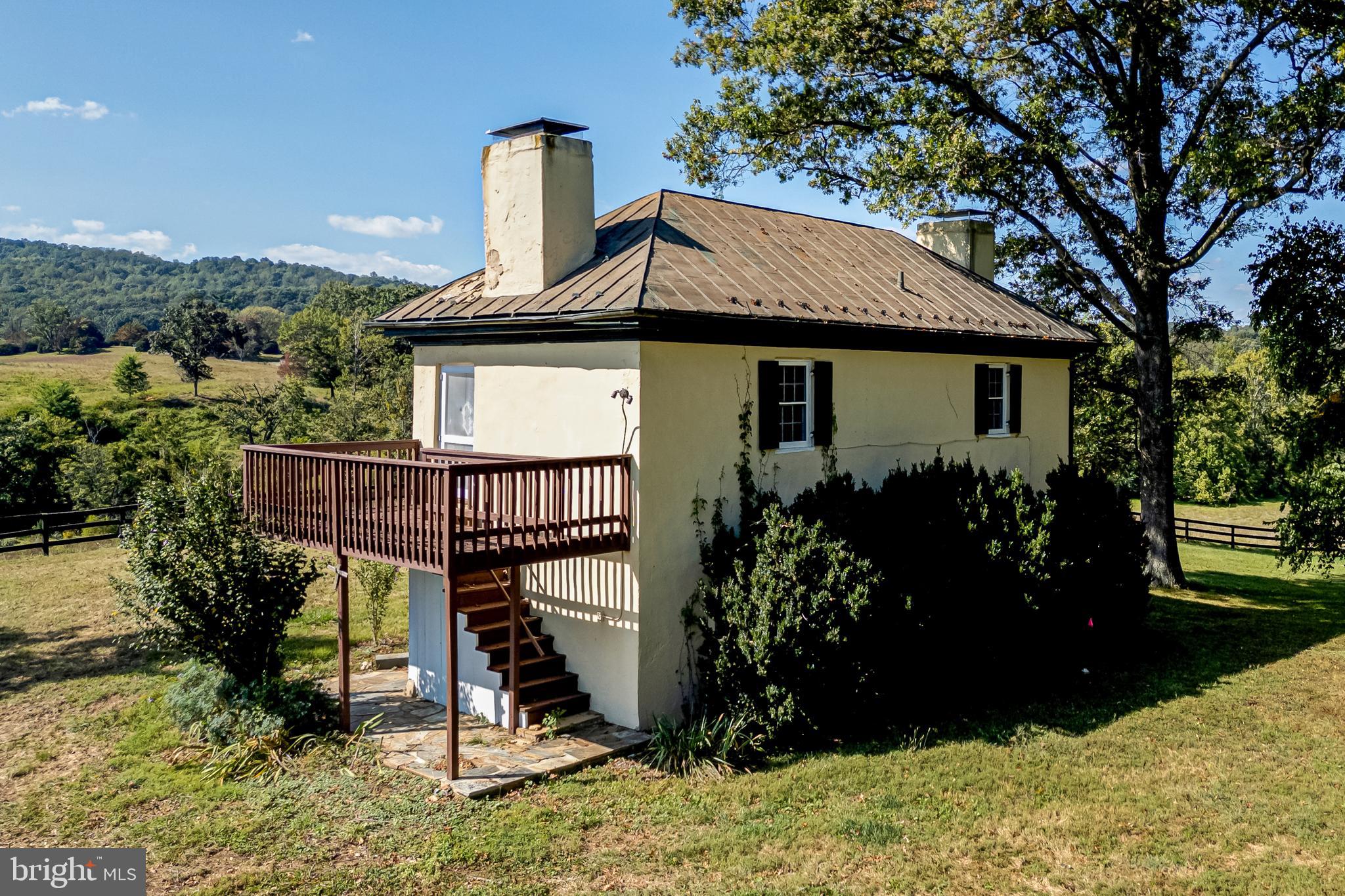 3707 Carrington Road Delaplane, VA 20144 - Photo 40 of 52 a view of house with a garden