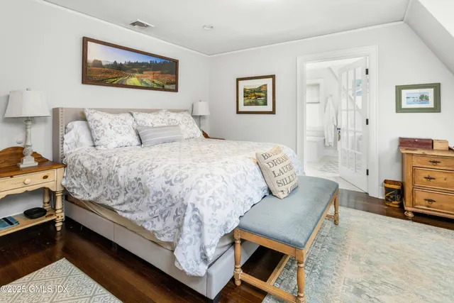 a bedroom with a bed and dresser