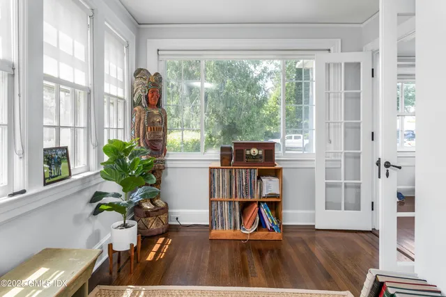 a view of a workspace with furniture and a potted plant