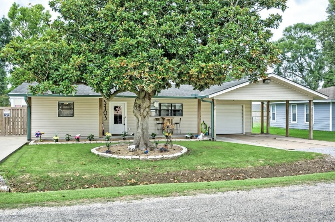 3103 Monroe Street Nederland, TX 77627 - Photo 1 of 11 a front view of house with a garden and patio