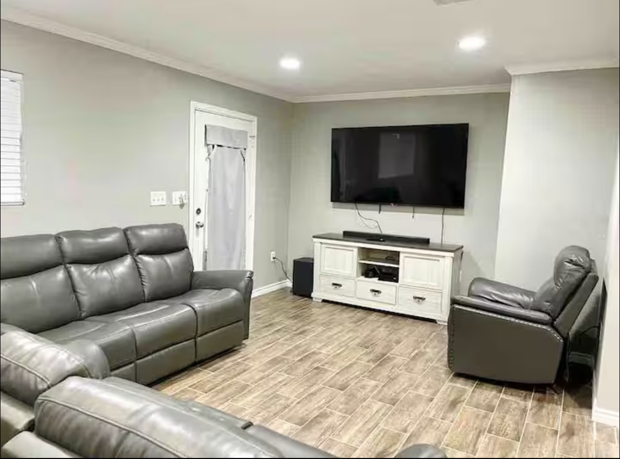 3103 Monroe Street Nederland, TX 77627 - Photo 3 of 11 a living room with furniture and a flat screen tv