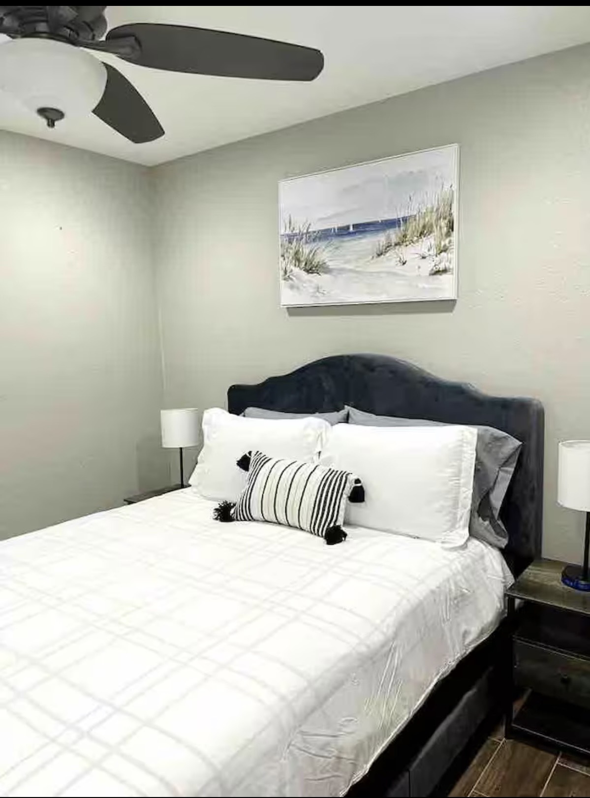 3103 Monroe Street Nederland, TX 77627 - Photo 5 of 11 a bedroom with a bed and painting on the wall