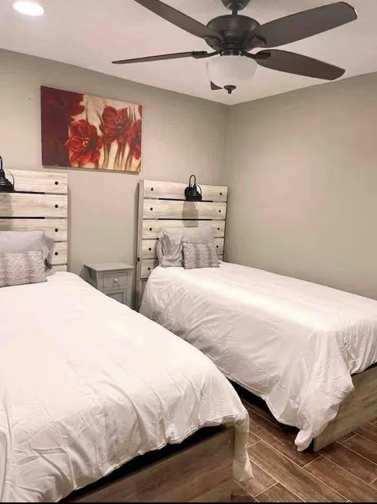 3103 Monroe Street Nederland, TX 77627 - Photo 9 of 11 a bedroom with a bed and a painting on the wall