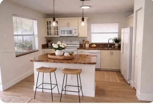 a view of a balcony with wooden floor