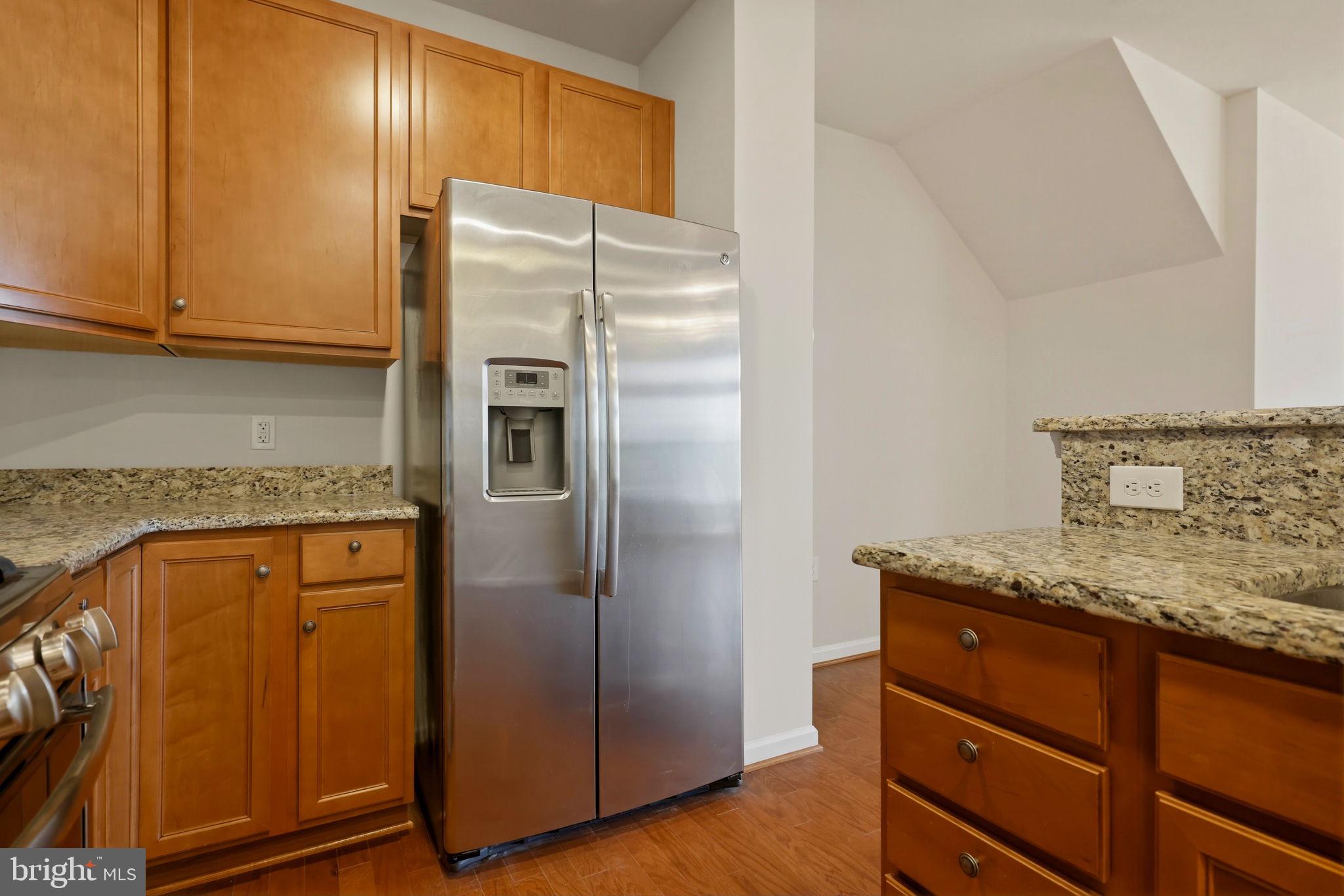 43487 Town Gate Square Chantilly, VA 20152 - Photo 13 of 56 a kitchen with stainless steel appliances granite countertop a refrigerator and a stove top oven