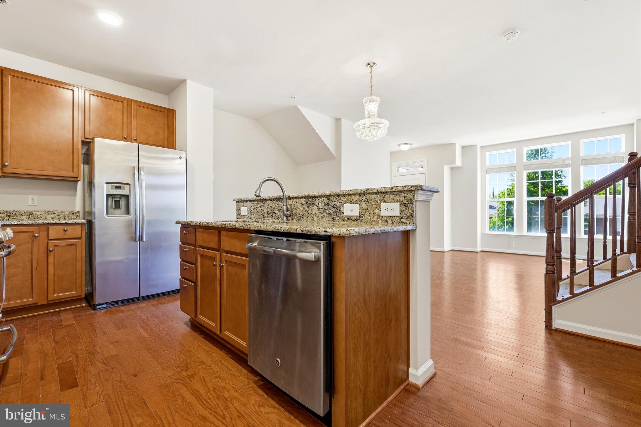 43487 Town Gate Square Chantilly, VA 20152 - Photo 15 of 56 a kitchen with stainless steel appliances granite countertop a refrigerator a sink and a stove