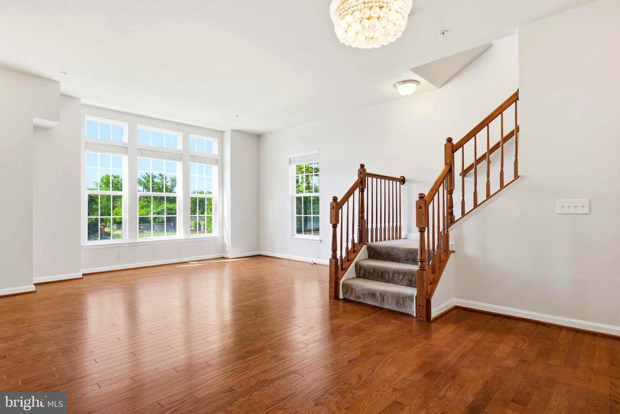 43487 Town Gate Square Chantilly, VA 20152 - Photo 16 of 56 a view of staircase with white walls and a window
