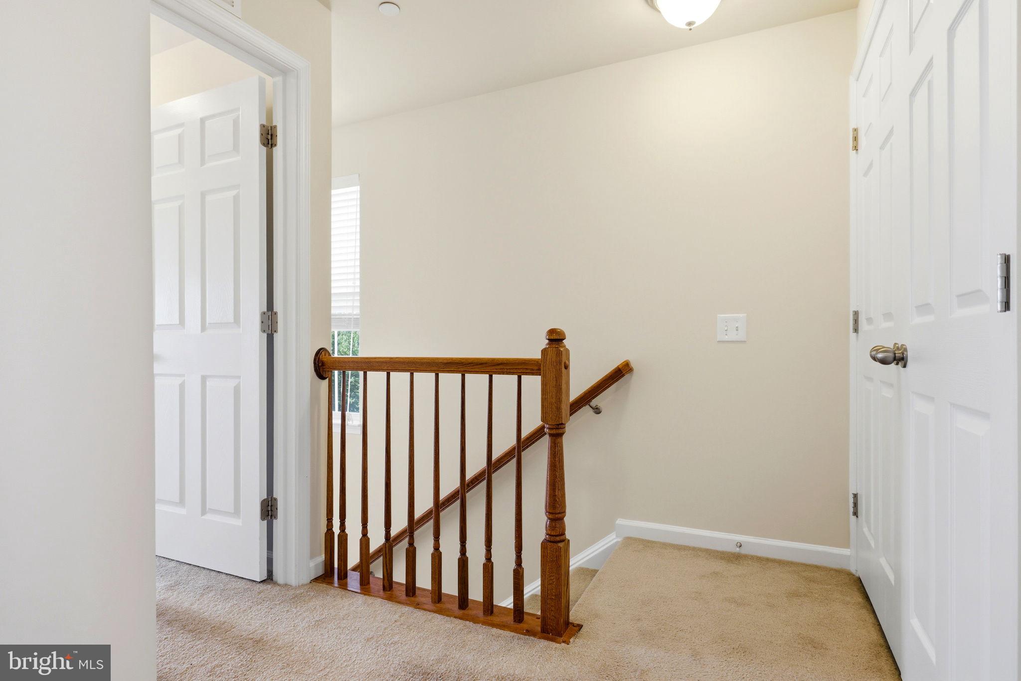 43487 Town Gate Square Chantilly, VA 20152 - Photo 24 of 56 a view of a hallway with staircase