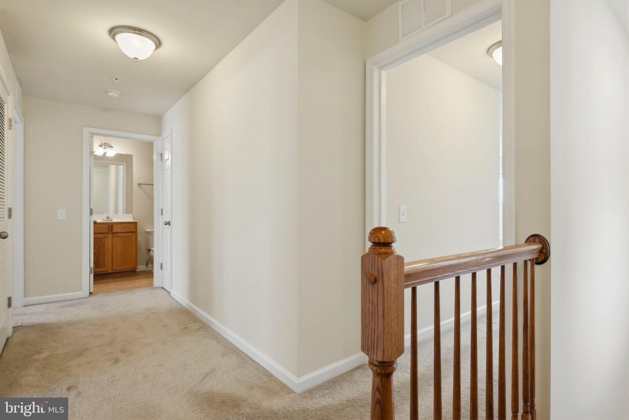 43487 Town Gate Square Chantilly, VA 20152 - Photo 25 of 56 a view of a hallway with a livingroom with furniture