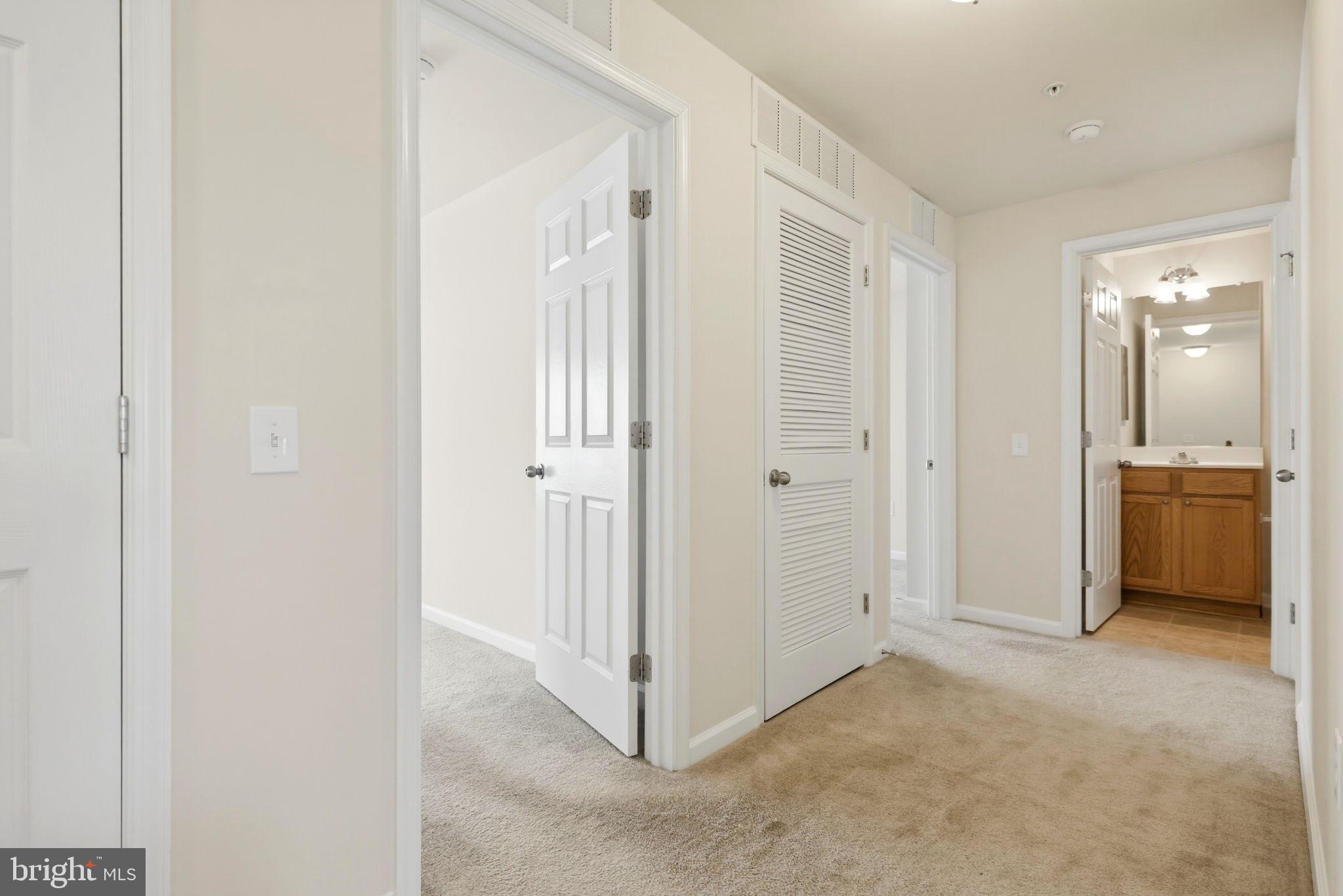 43487 Town Gate Square Chantilly, VA 20152 - Photo 34 of 56 a view of a hallway with a bathroom