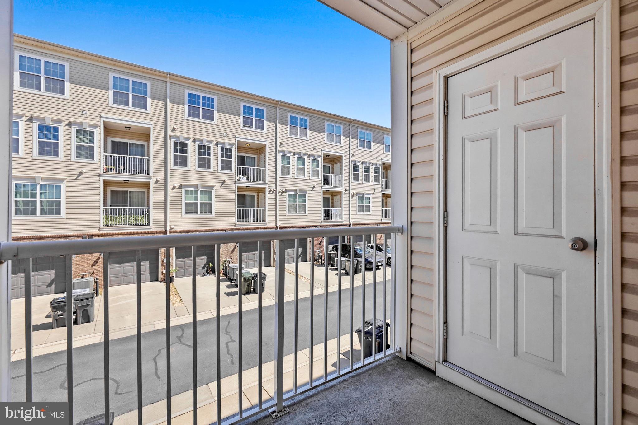 43487 Town Gate Square Chantilly, VA 20152 - Photo 42 of 56 a view of a large building from a porch
