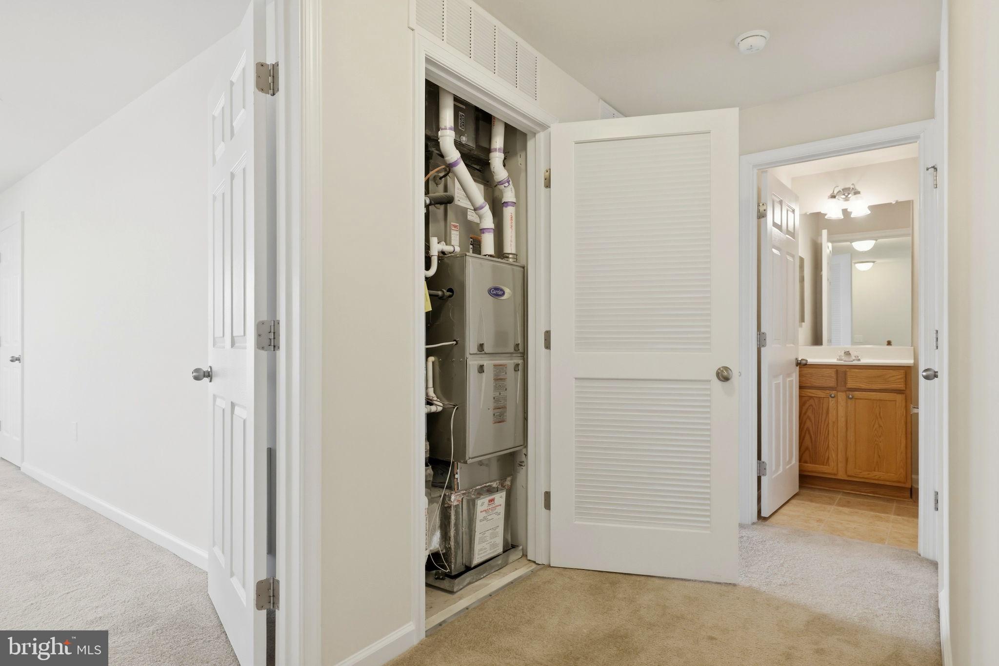 43487 Town Gate Square Chantilly, VA 20152 - Photo 44 of 56 a view of a hallway with closet and bathroom