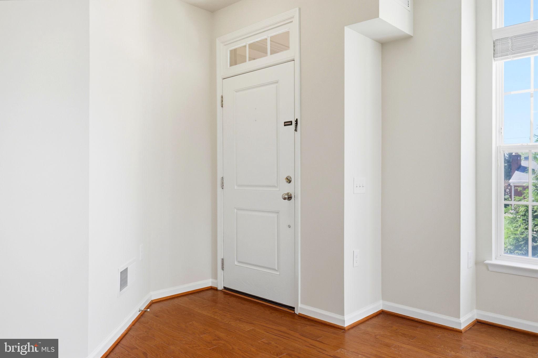 43487 Town Gate Square Chantilly, VA 20152 - Photo 46 of 56 a view of an empty room with wooden floor