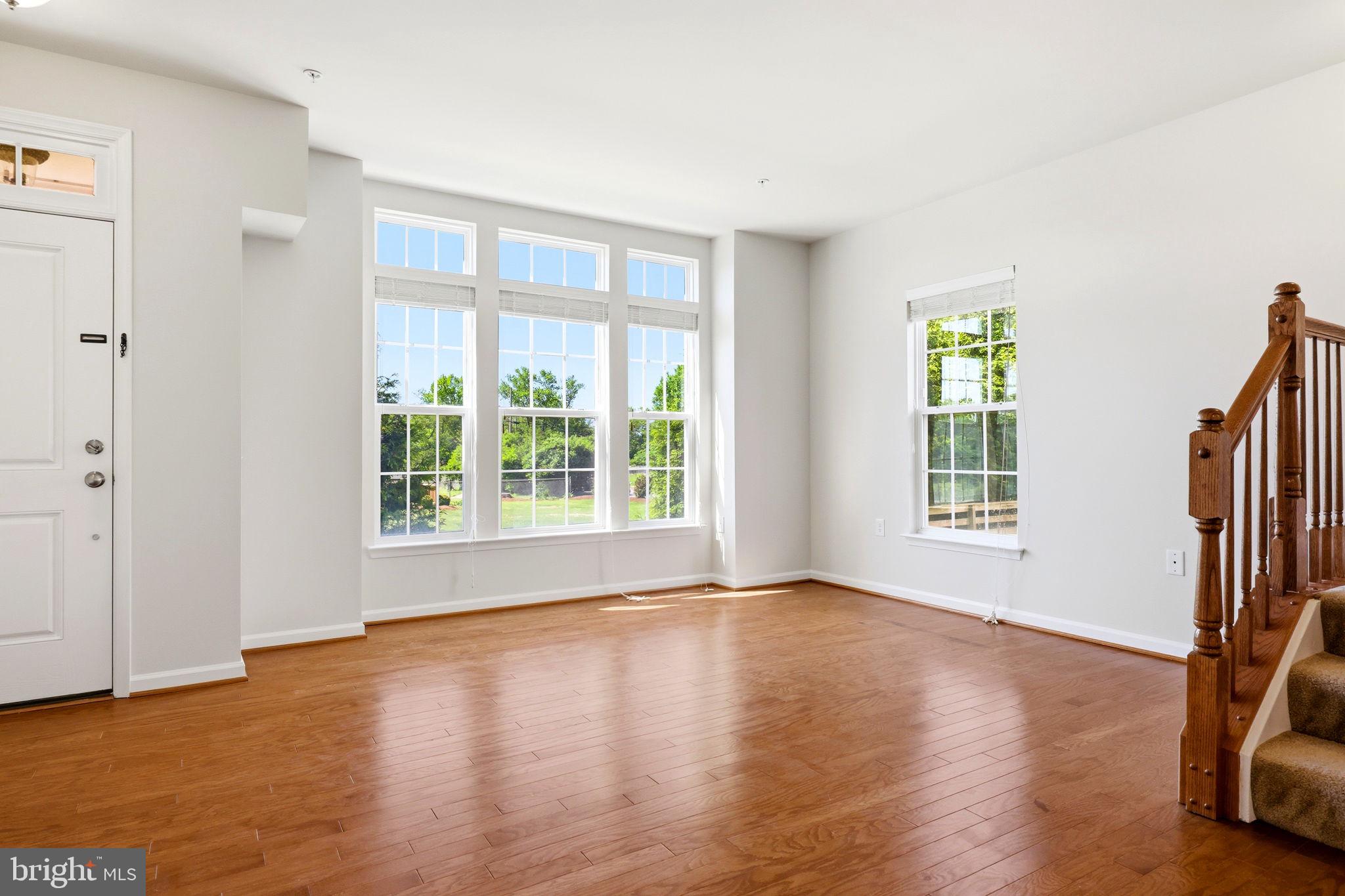 43487 Town Gate Square Chantilly, VA 20152 - Photo 47 of 56 a view of empty room with wooden floor and fan