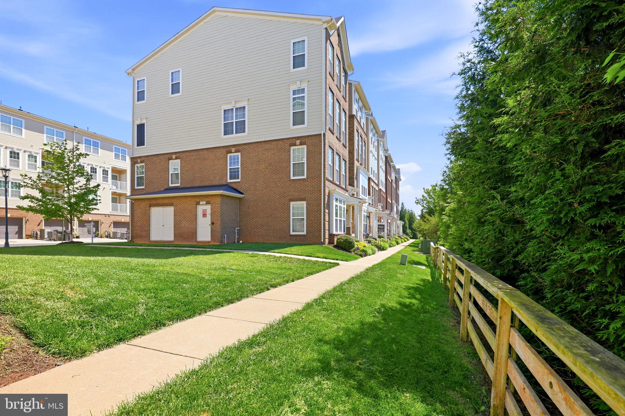 43487 Town Gate Square Chantilly, VA 20152 - Photo 48 of 56 a view of a house with a yard