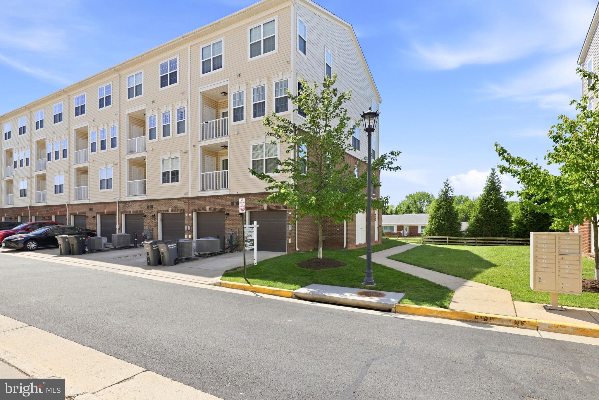 43487 Town Gate Square Chantilly, VA 20152 - Photo 50 of 56 front view of a building with a street