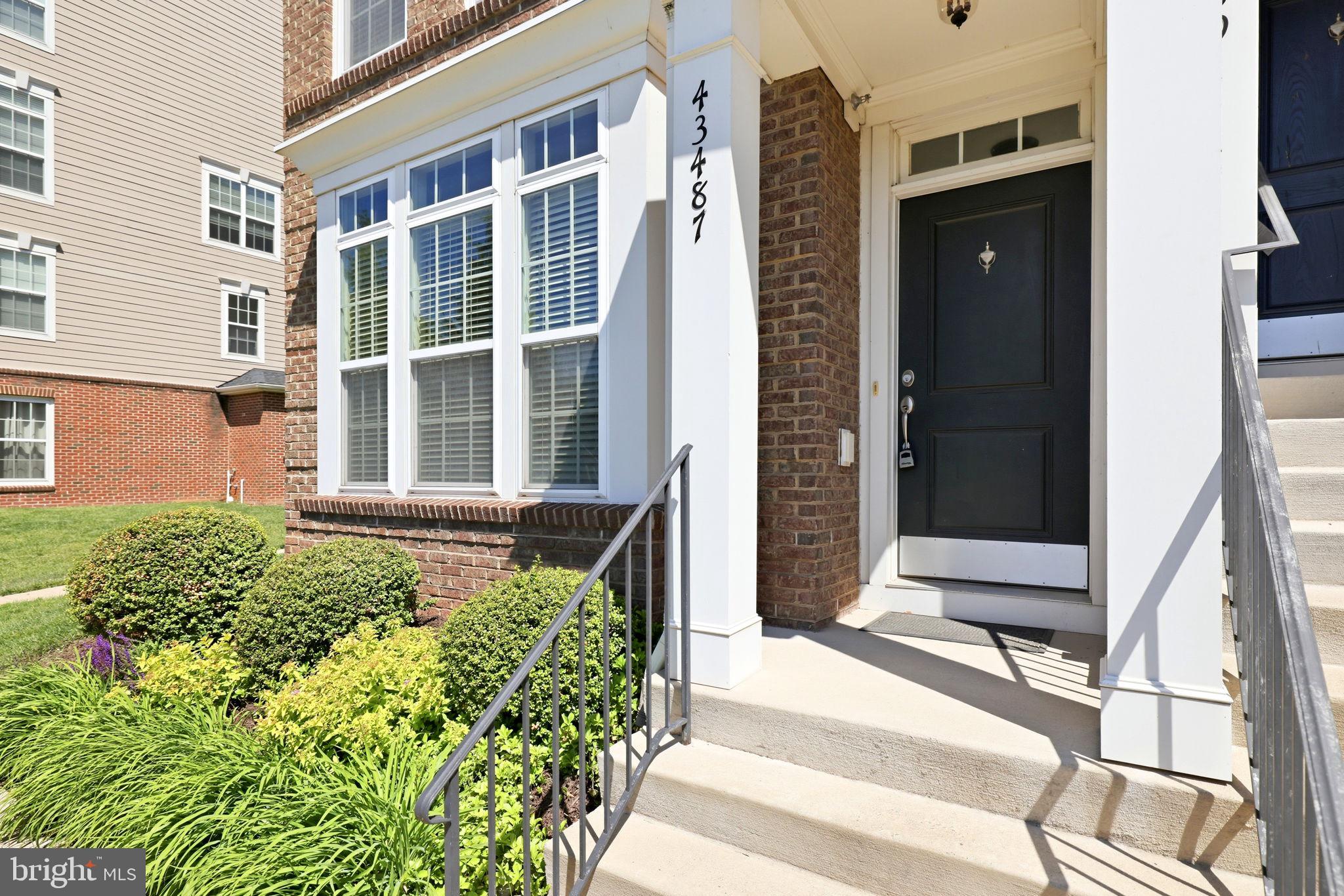 43487 Town Gate Square Chantilly, VA 20152 - Photo 5 of 56 a view of a building with a outdoor space