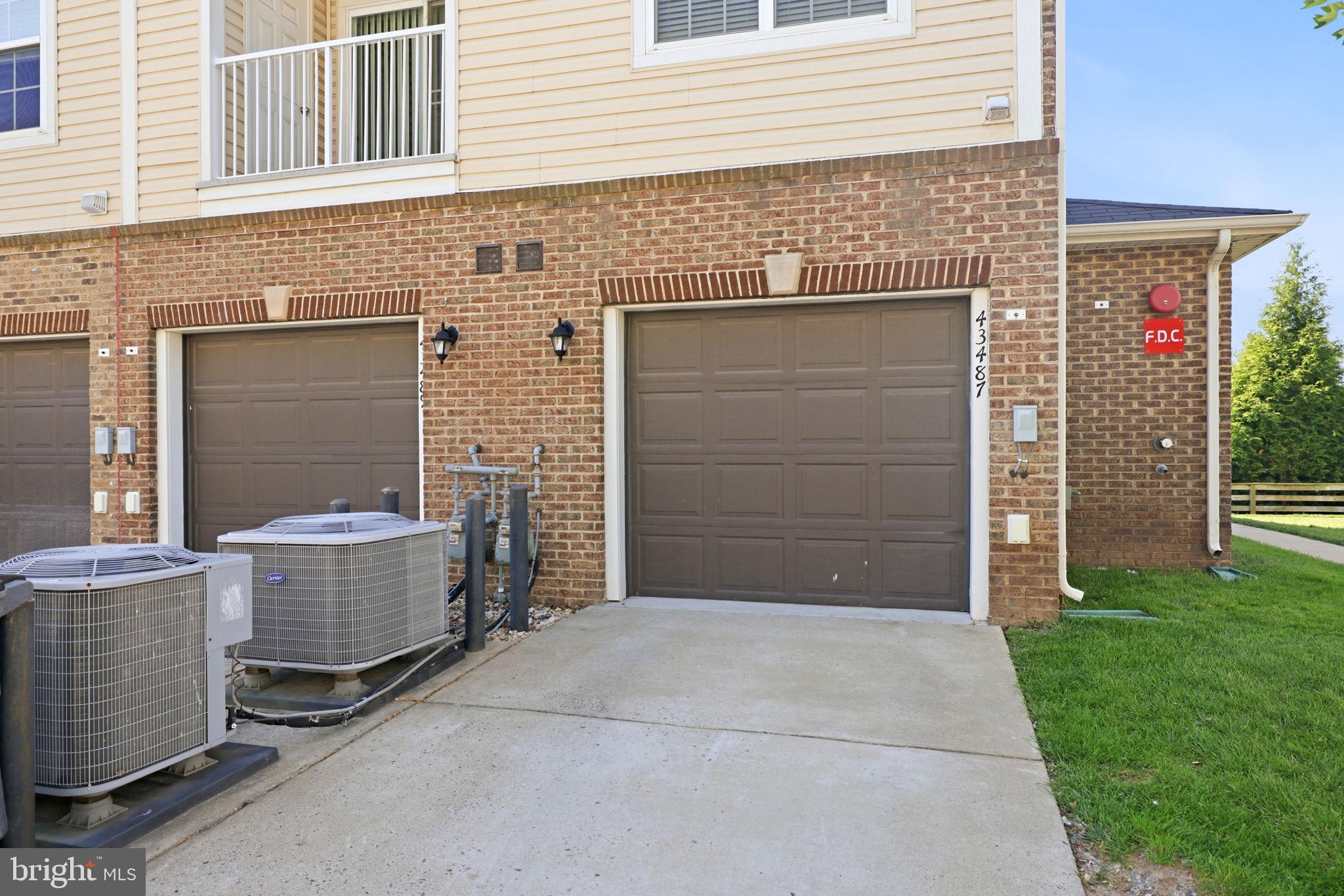 43487 Town Gate Square Chantilly, VA 20152 - Photo 52 of 56 a front view of a house with a garage