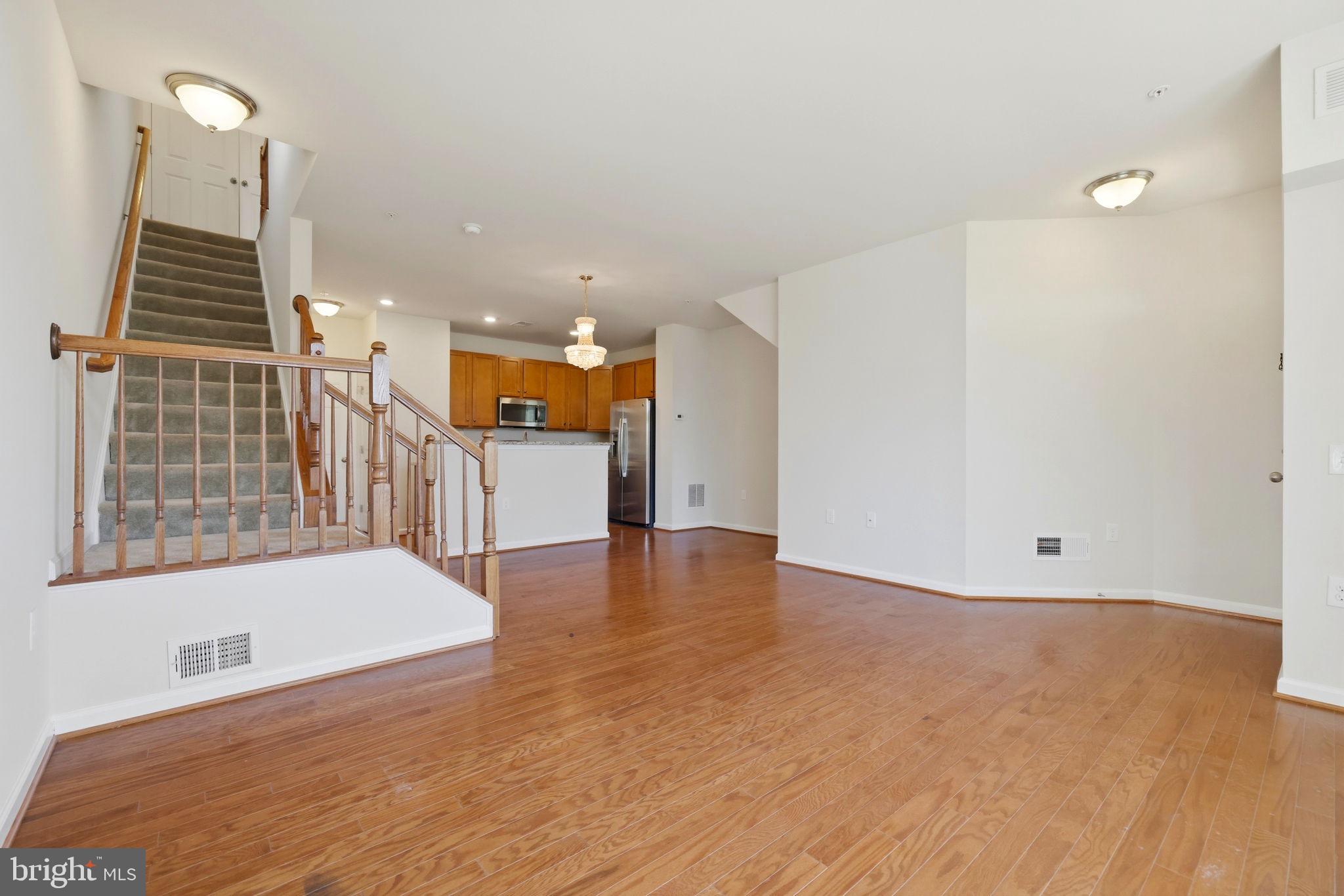 43487 Town Gate Square Chantilly, VA 20152 - Photo 7 of 56 a view of a kitchen with a sink and dishwasher with wooden floor